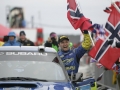 Subaru driver Petter Solberg celebrates his victory in the Swedish Rally 2005 on his way into final service.